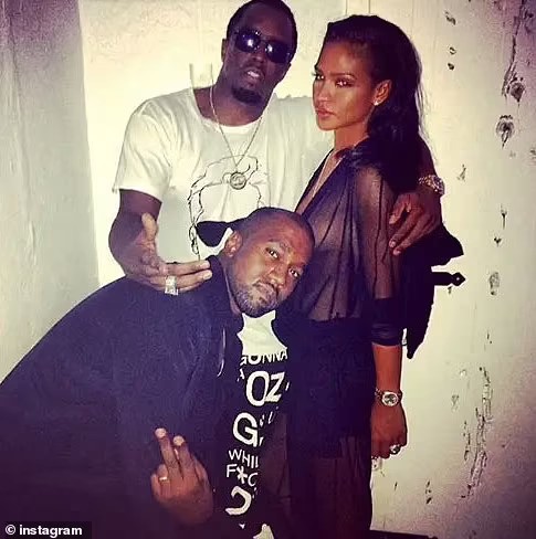 West flashed a peace sign as he stood alongside Diddy