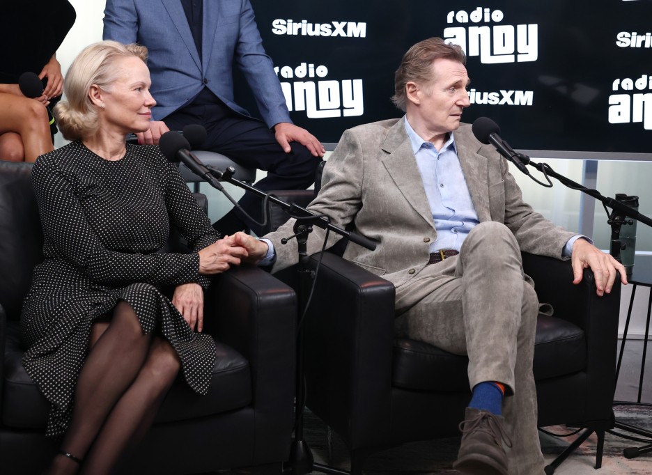 Liam Neeson and Pamela ANderson hold hand sirius Naked Gun